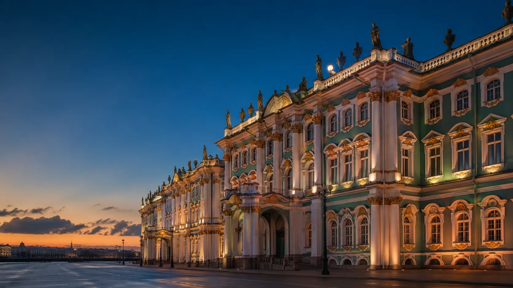 The Winter Palace, main building of the State Hermitage Museum, floodlit at dusk on Palace Square in Saint Petersburg